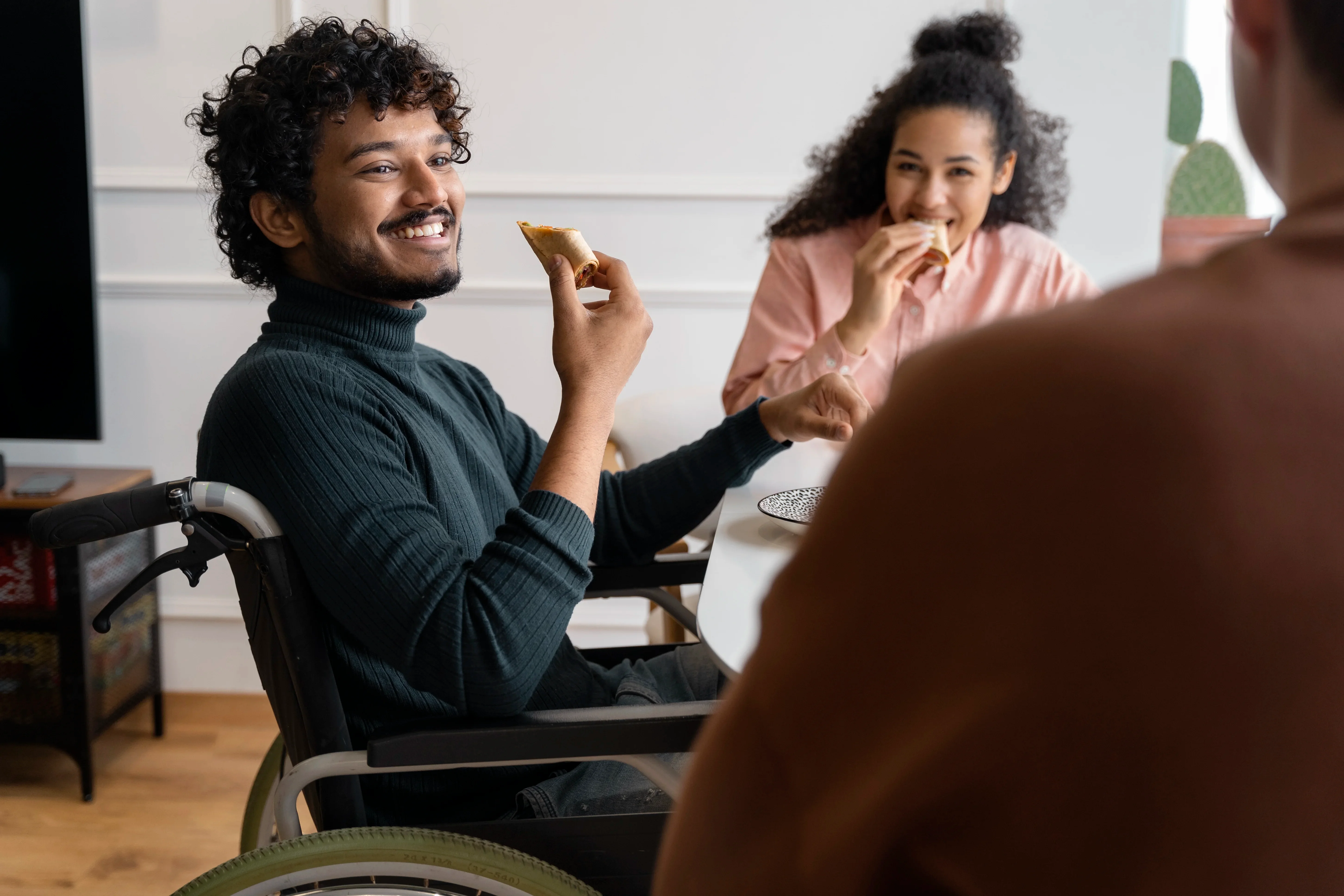 Friends laughing and spending time together at home