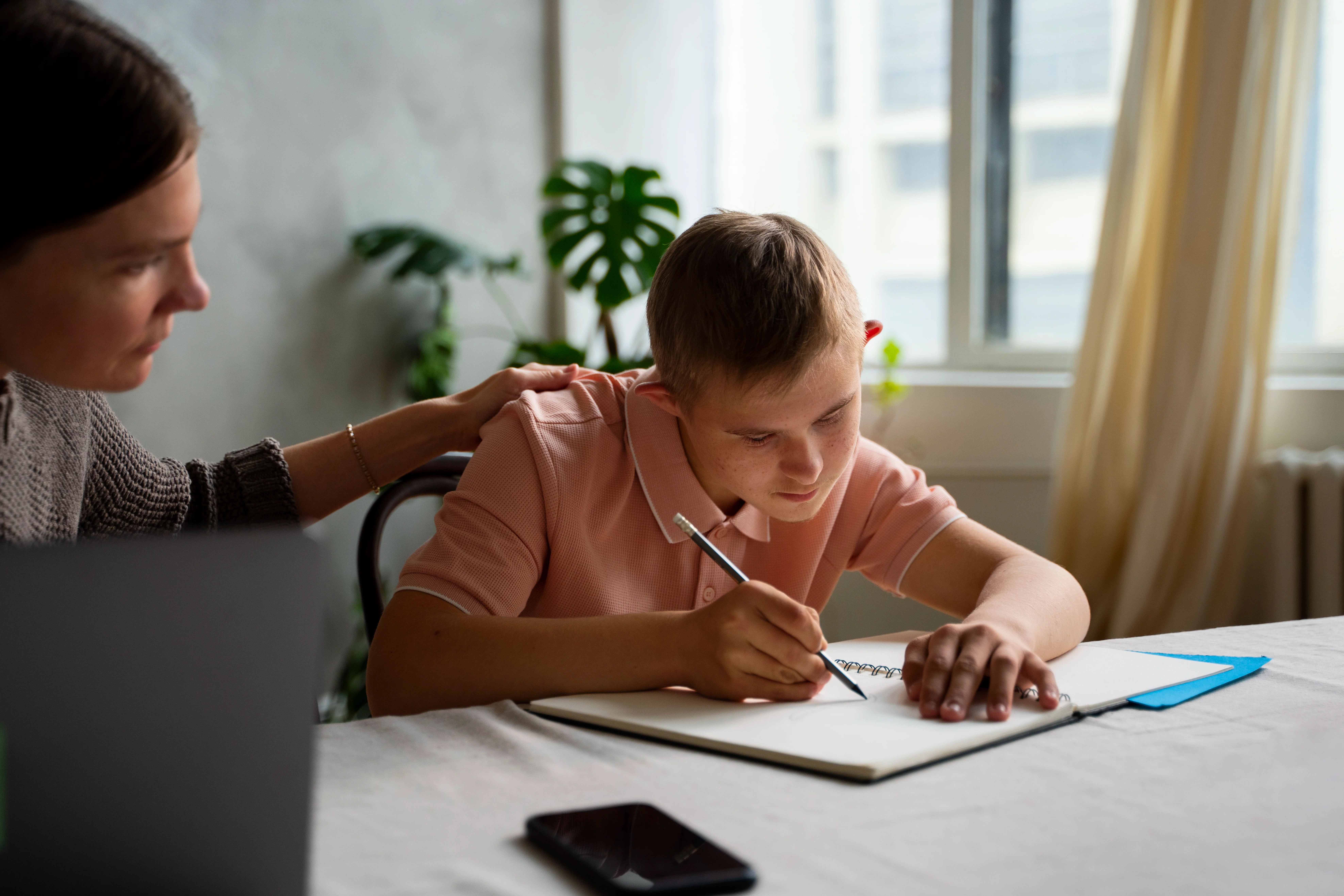A young person with learning disabilities being supported