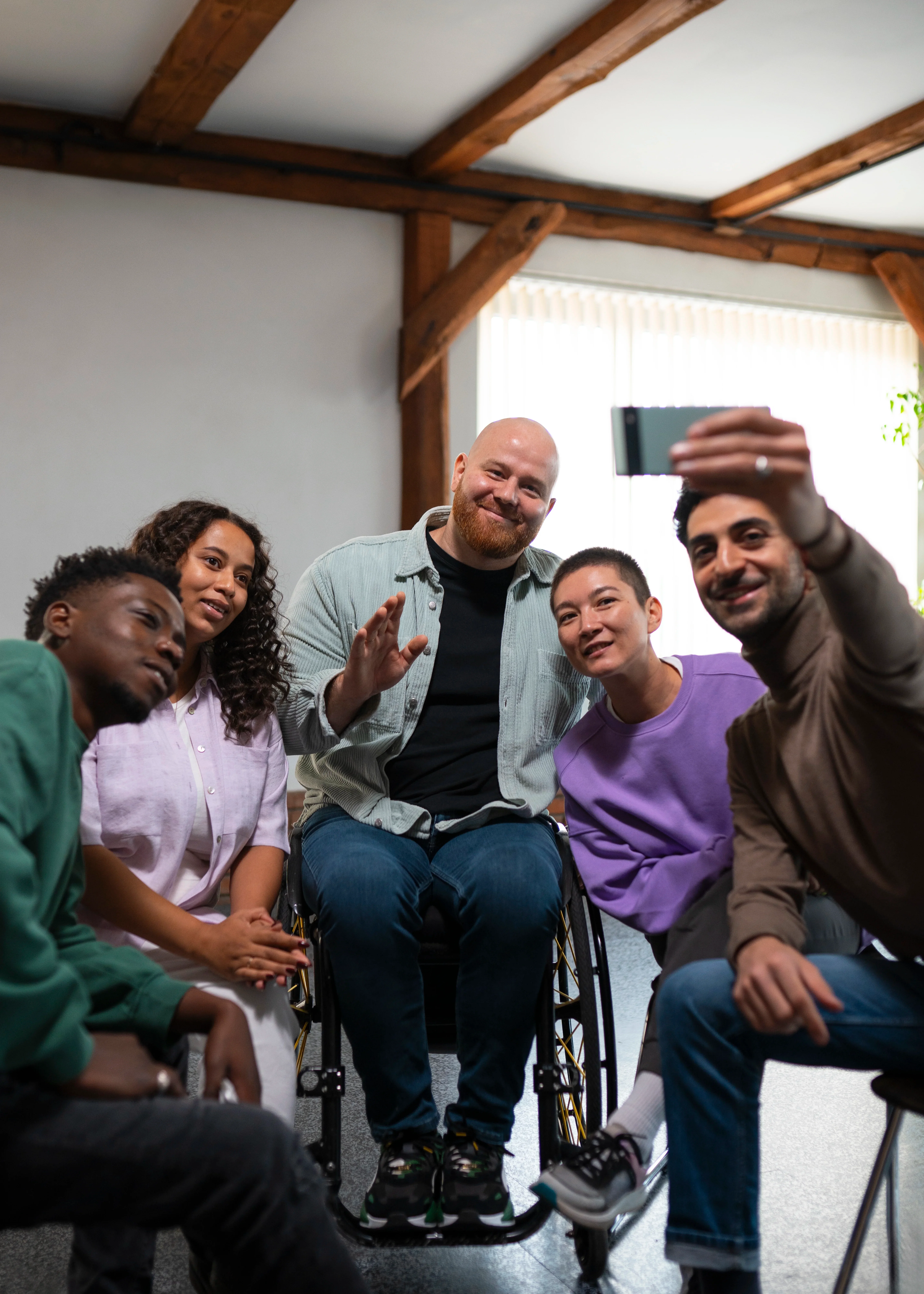 A small group sitting in a circle during a supportive meeting